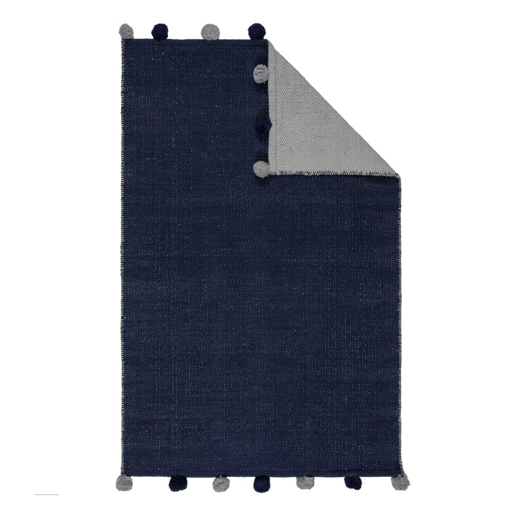 Sötétkék pamut gyerek szőnyeg 100x150 cm Pom Edge Reversible – Flair Rugs